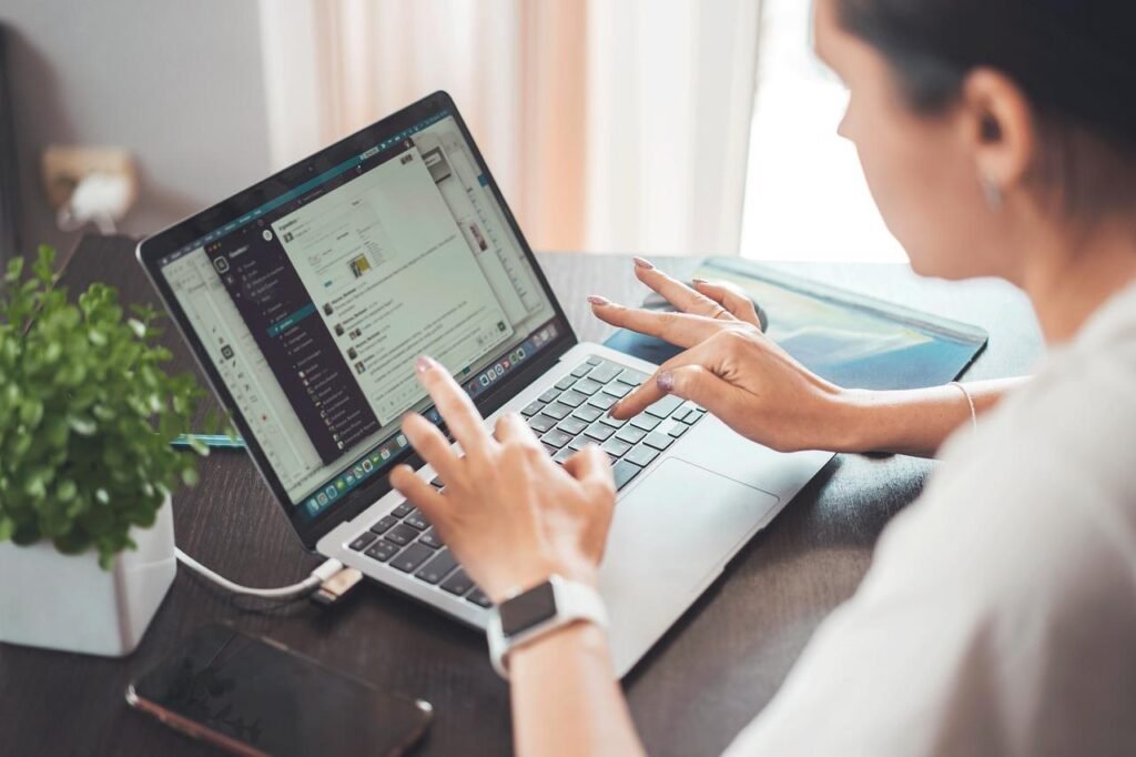 Remote Operations Done Right: Tools That Replace Traditional Office Functions Professional using remote operations and collaboration tools on a laptop