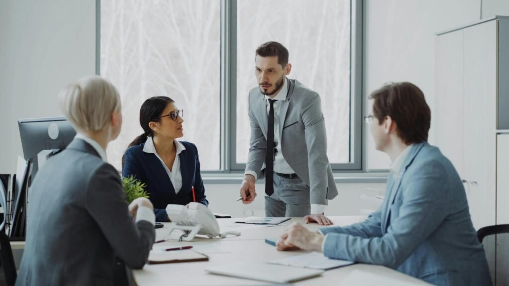 Why Continuous Learning Matters: How Curated Business Resources Fuel Long-Term Success Business professionals discussing continuous learning strategies in a modern office meeting