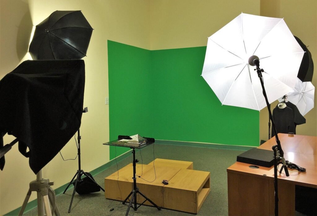 Why Growing Businesses Should Invest in Professional Video Content Professional video production studio with green screen and lighting equipment for business content creation.