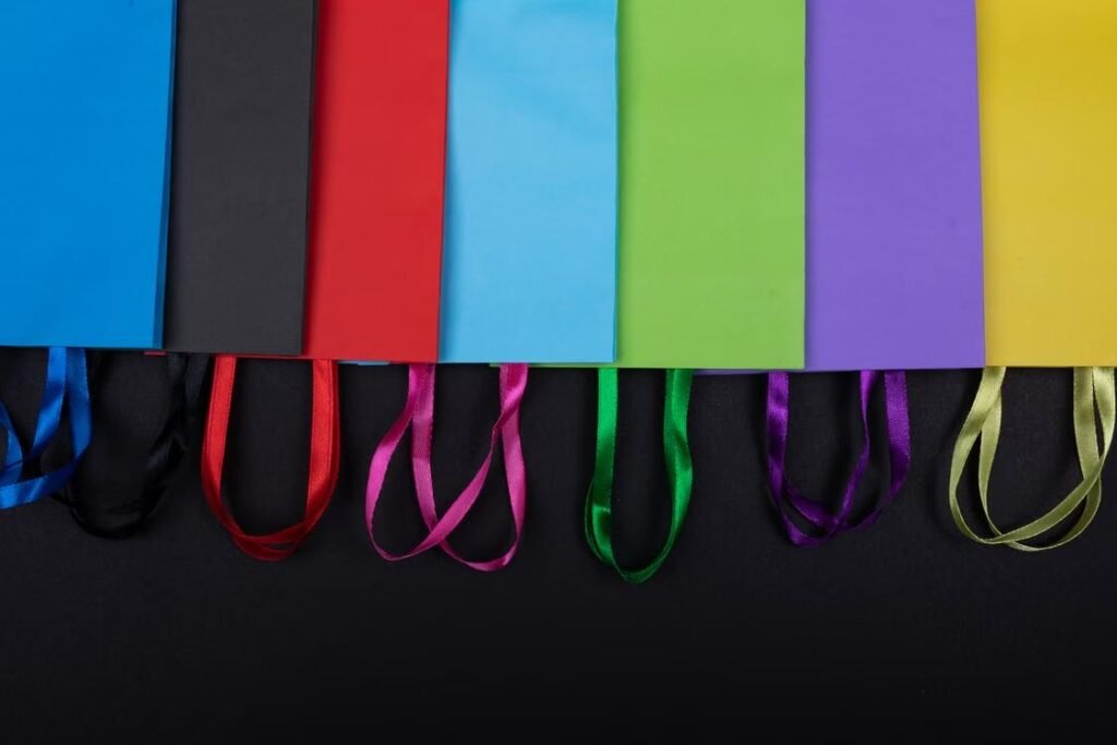 Designing Branded Event Merchandise That Reinforces Core Marketing Messages Colorful branded shopping bags representing event merchandise and marketing campaigns.