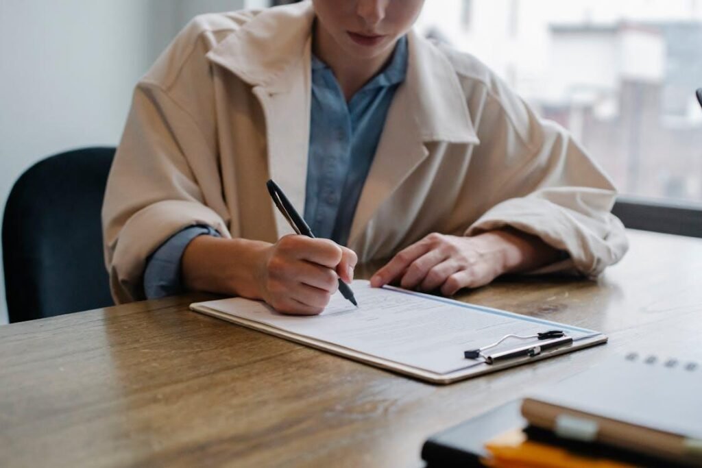 Consultant reviewing resume documents at a workspace